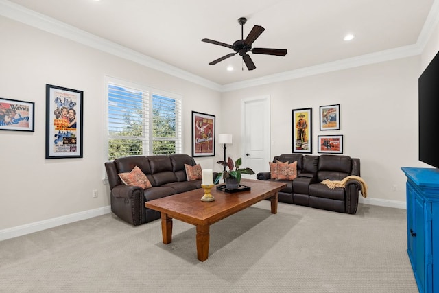 living area featuring light colored carpet, ceiling fan, baseboards, and ornamental molding