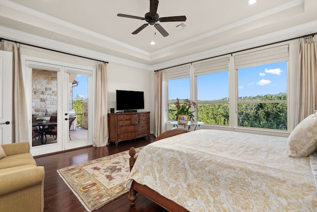 bedroom featuring visible vents, access to exterior, dark wood-type flooring, crown molding, and a raised ceiling