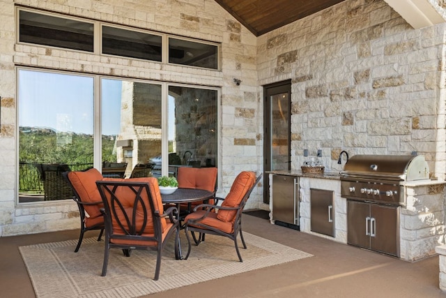 view of patio featuring area for grilling and outdoor dining space