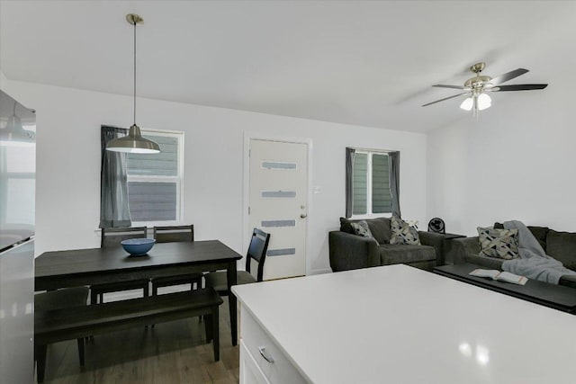 dining area featuring light wood-style flooring and ceiling fan