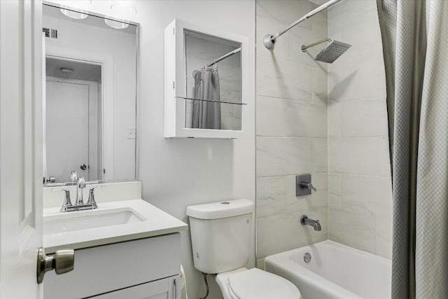 bathroom featuring visible vents, toilet, vanity, and shower / bathtub combination with curtain