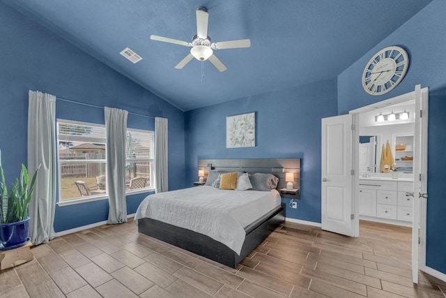 bedroom featuring lofted ceiling, baseboards, visible vents, and wood finish floors