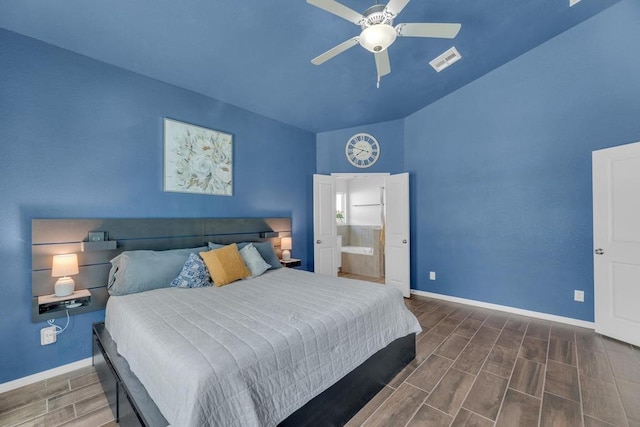 bedroom featuring wood finish floors, visible vents, ensuite bathroom, a ceiling fan, and baseboards