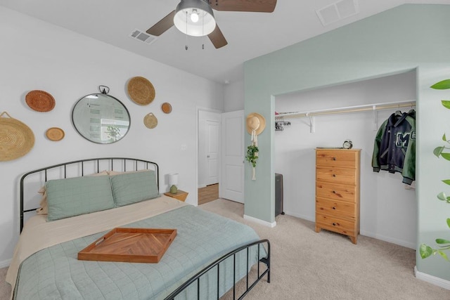 bedroom featuring a ceiling fan, carpet, visible vents, and baseboards