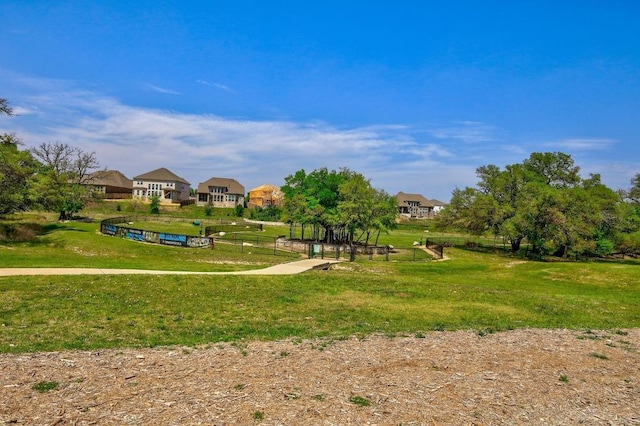 view of property's community with a yard