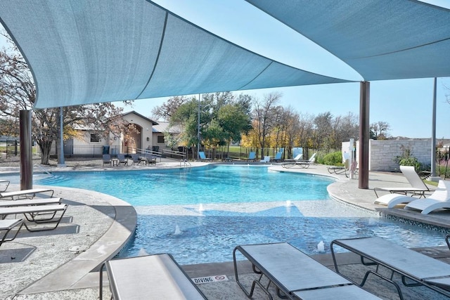 pool featuring a patio and fence