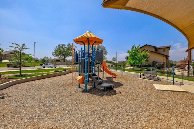 community jungle gym with fence