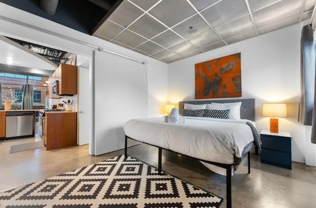 bedroom featuring finished concrete flooring and a paneled ceiling