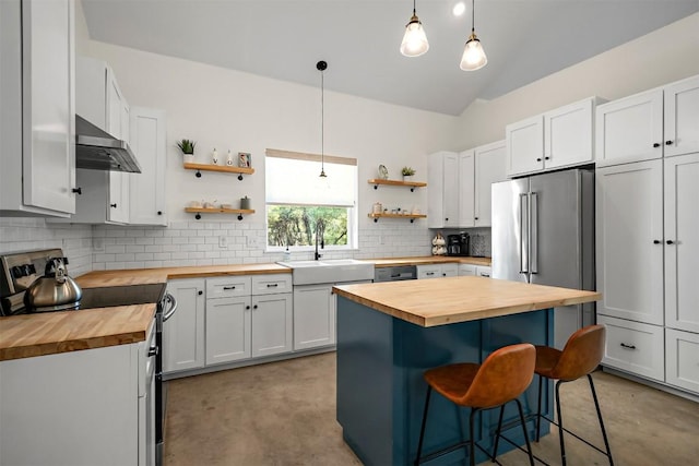 kitchen featuring range with electric cooktop, ventilation hood, high end fridge, wood counters, and open shelves