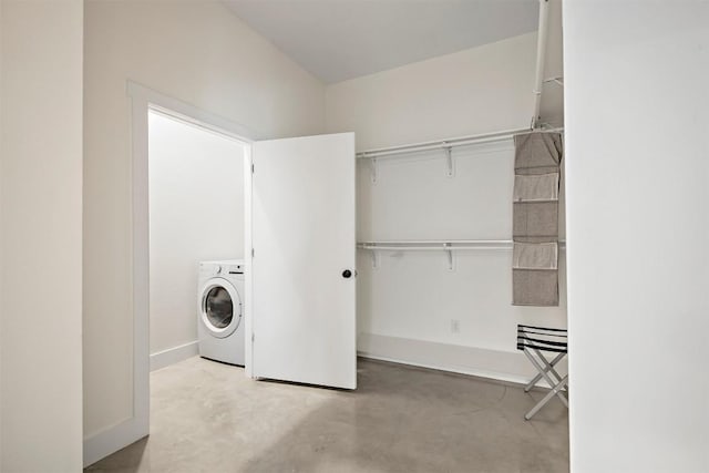 washroom featuring washer / dryer, baseboards, and laundry area