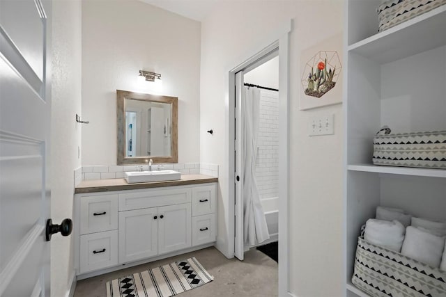 bathroom with vanity and concrete floors