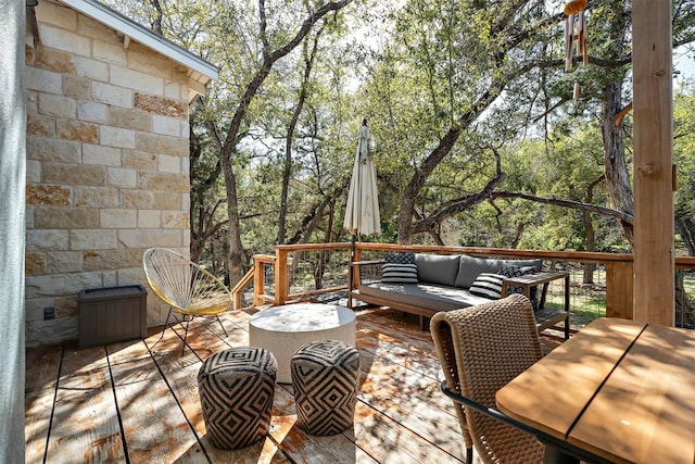 wooden deck with an outdoor living space