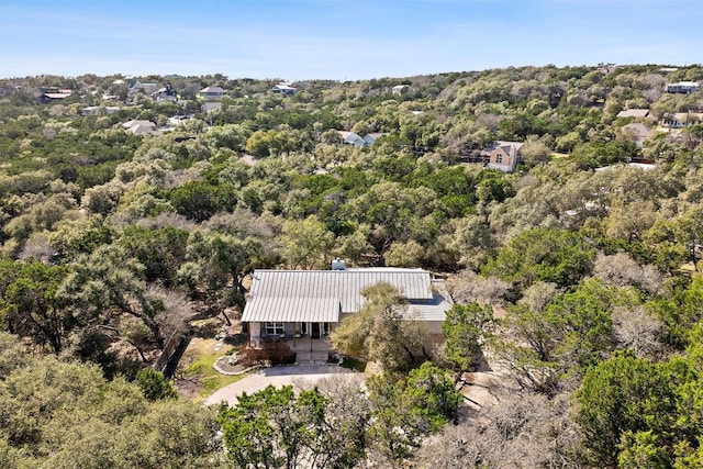 drone / aerial view featuring a forest view