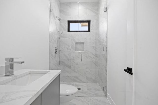 full bathroom featuring a marble finish shower, marble finish floor, toilet, and vanity