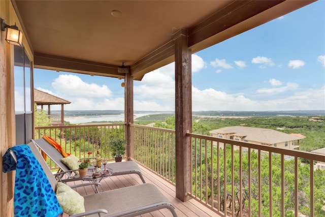 wooden deck featuring a water view