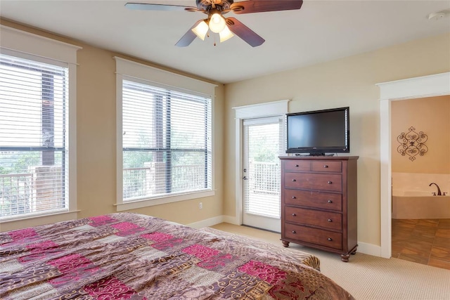 bedroom featuring access to exterior, light colored carpet, baseboards, and ceiling fan