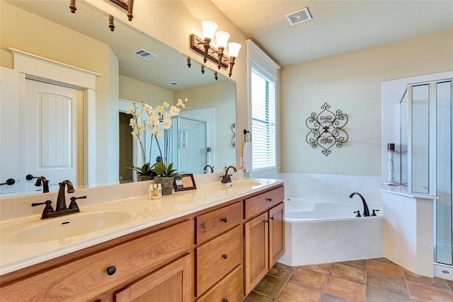 bathroom featuring a sink, visible vents, a garden tub, and a shower stall