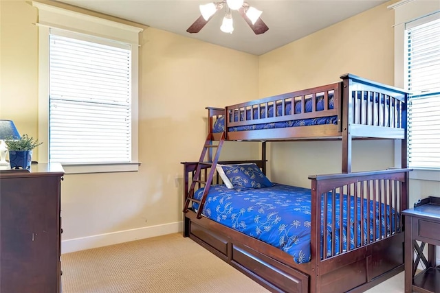 bedroom featuring a ceiling fan, carpet, and baseboards