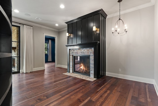 unfurnished living room with visible vents, baseboards, crown molding, and hardwood / wood-style flooring