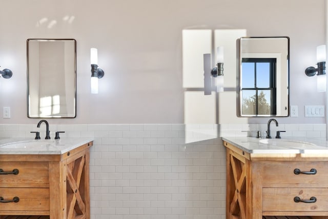 full bathroom featuring two vanities and a sink