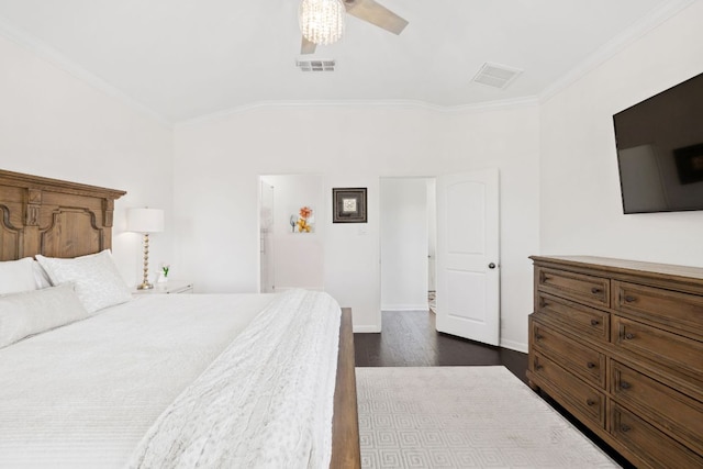 bedroom with visible vents, dark wood-style flooring, baseboards, and ornamental molding