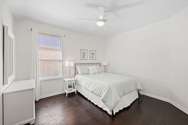 bedroom with a ceiling fan, baseboards, and dark wood-style flooring