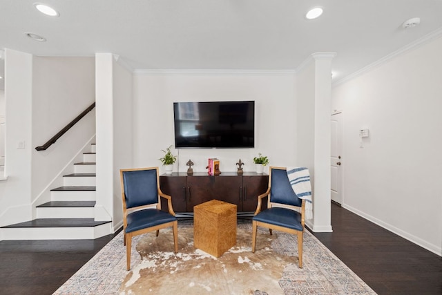 sitting room featuring stairs, crown molding, wood finished floors, and baseboards