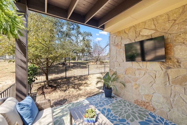 view of patio / terrace featuring fence