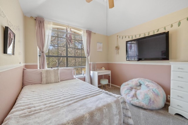 bedroom with vaulted ceiling, carpet flooring, and ceiling fan