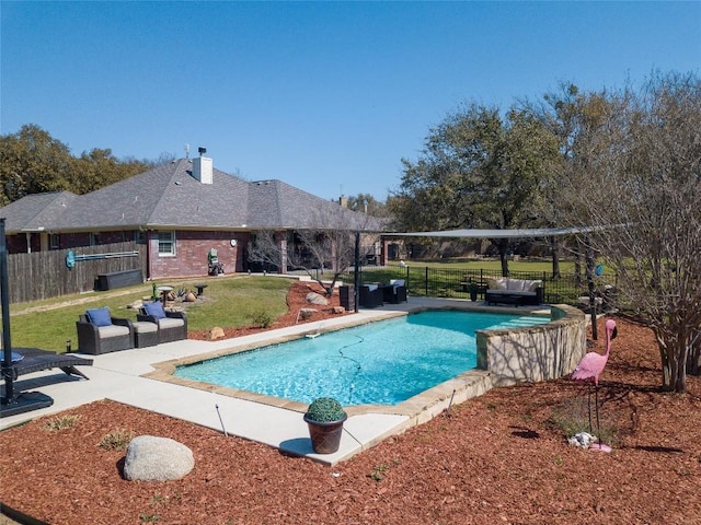 view of swimming pool featuring a patio area, a lawn, outdoor lounge area, and a fenced in pool