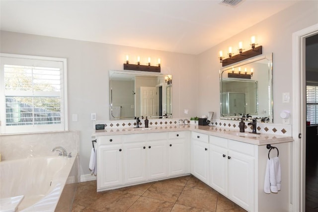 bathroom with a bath, tile patterned floors, a stall shower, and vanity