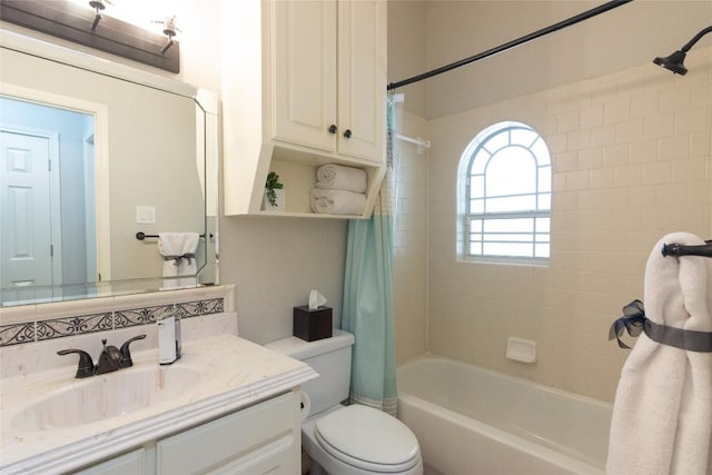 bathroom with toilet, vanity, and shower / bathtub combination with curtain