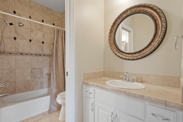 bathroom featuring tile patterned floors, shower / bath combo with shower curtain, toilet, and vanity