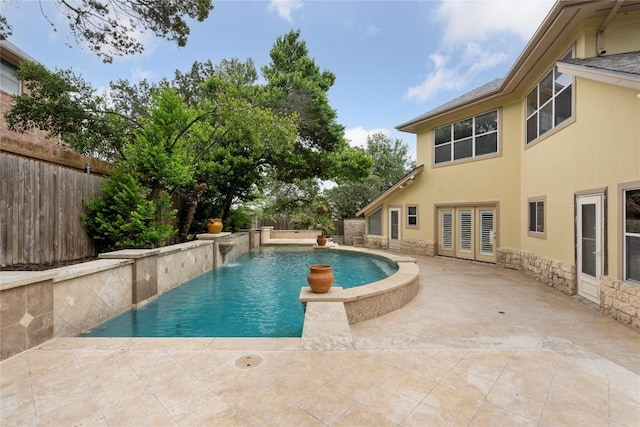 view of pool with a fenced backyard, a fenced in pool, and a patio