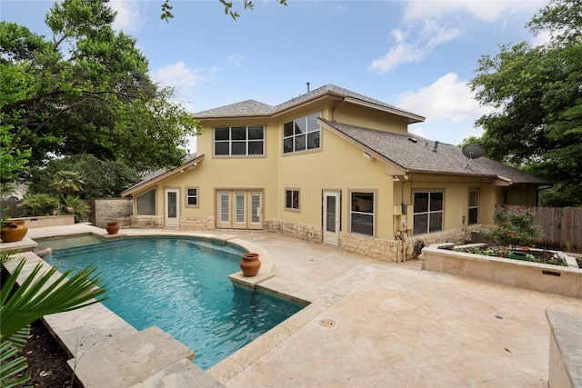 view of swimming pool featuring a fenced in pool, a patio area, and fence