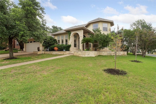 mediterranean / spanish-style home featuring a garage, driveway, a front yard, and stucco siding