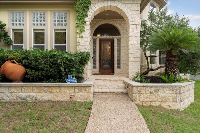 doorway to property with stone siding