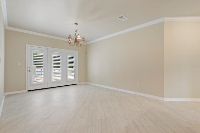 spare room with a notable chandelier, baseboards, visible vents, and ornamental molding