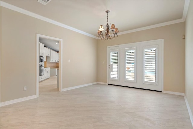 spare room featuring visible vents, baseboards, a notable chandelier, and crown molding