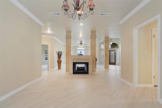 unfurnished living room featuring a fireplace, crown molding, baseboards, and visible vents