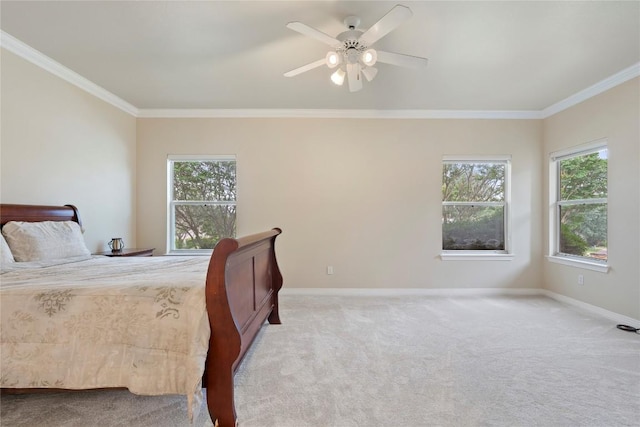 bedroom with multiple windows, baseboards, and ornamental molding