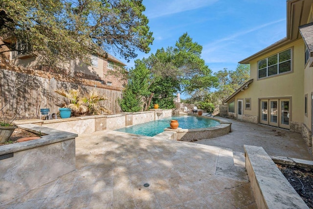 9907 Spicewood Mesa, Austin, TX 78759 - view of pool featuring a fenced backyard, french doors, and a patio area