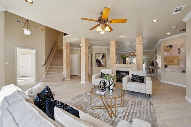 9907 Spicewood Mesa, Austin, TX 78759 - living area featuring recessed lighting, stairway, ceiling fan, crown molding, and a glass covered fireplace