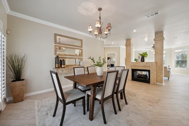 9907 Spicewood Mesa, Austin, TX 78759 - dining room with ornamental molding, a ceiling fan, a multi sided fireplace, recessed lighting, and a chandelier