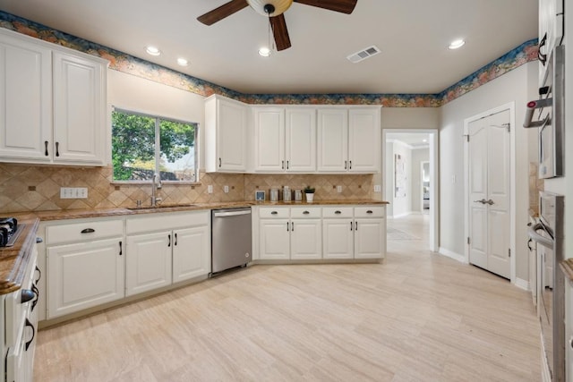 9907 Spicewood Mesa, Austin, TX 78759 - kitchen with dishwasher, ceiling fan, decorative backsplash, white cabinets, and recessed lighting