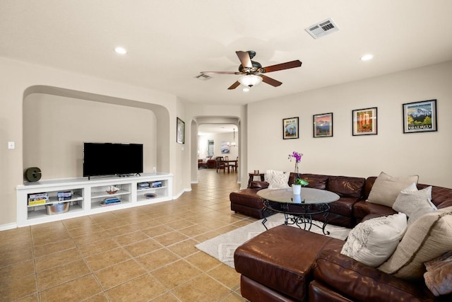 living room featuring visible vents, ceiling fan, light tile patterned floors, recessed lighting, and arched walkways