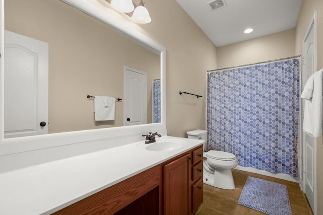 full bath featuring vanity, a shower with curtain, visible vents, tile patterned flooring, and toilet