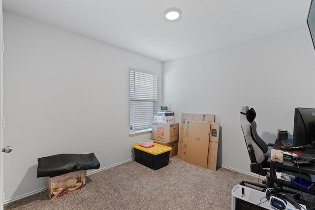 carpeted home office with baseboards