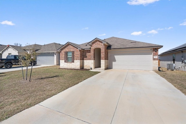 ranch-style home with driveway, stone siding, a front yard, an attached garage, and brick siding