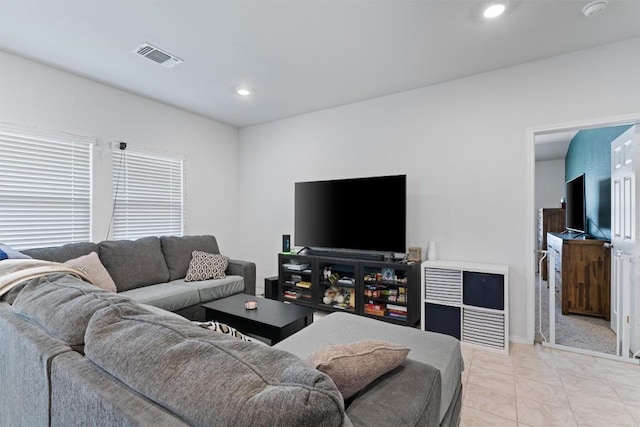 living room with light tile patterned floors, recessed lighting, and visible vents